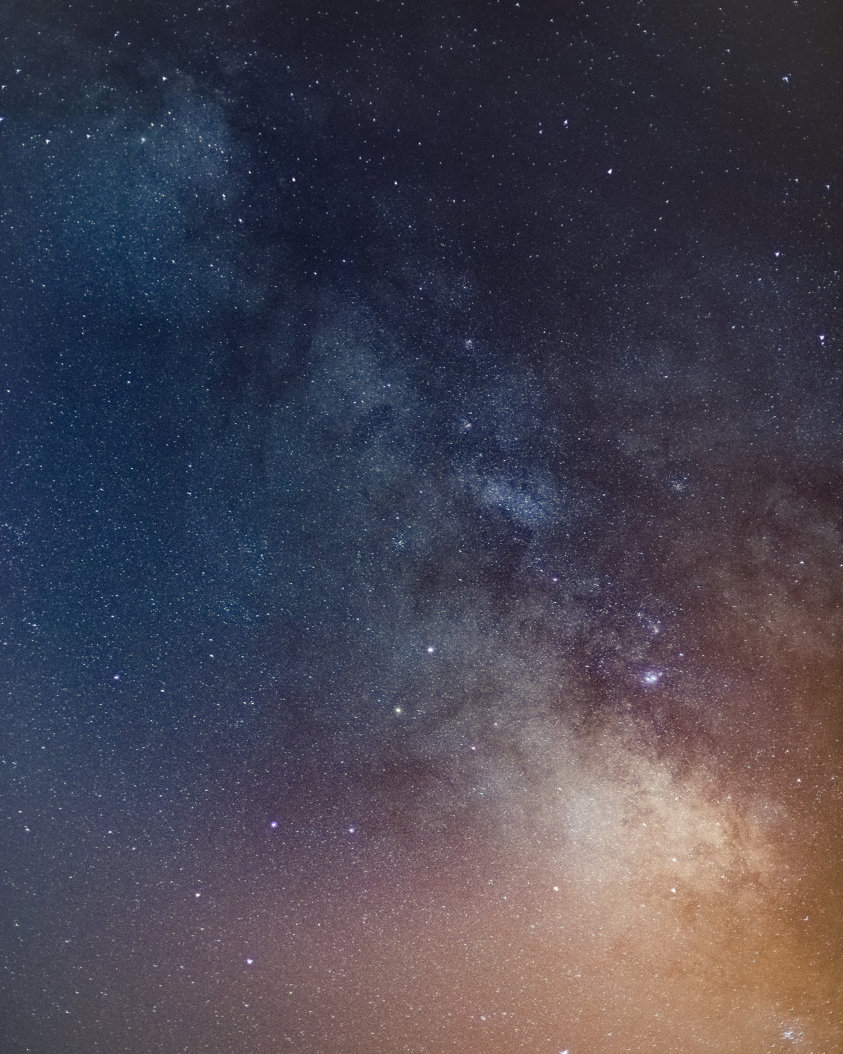 blue and orange starry night sky